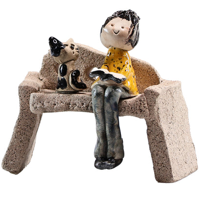 Handmade Ceramic Figurine of Lady with Cat Reading on Bench