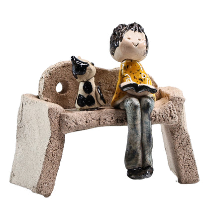 Handmade Ceramic Figurine of Lady with Cat Reading on Bench