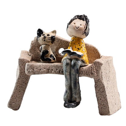 Handmade Ceramic Figurine of Lady with Cat Reading on Bench