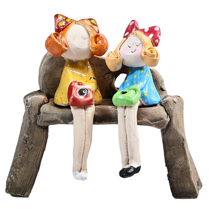 Handmade ceramic figurine of Charming Couple on Bench with Colourful Accessories